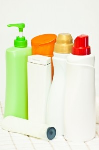 bottles with various coloured tops for shampoo etc