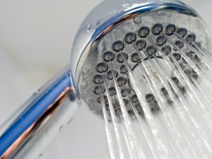 a shower head with water coming out of it