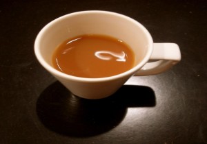 a white mug containing tea